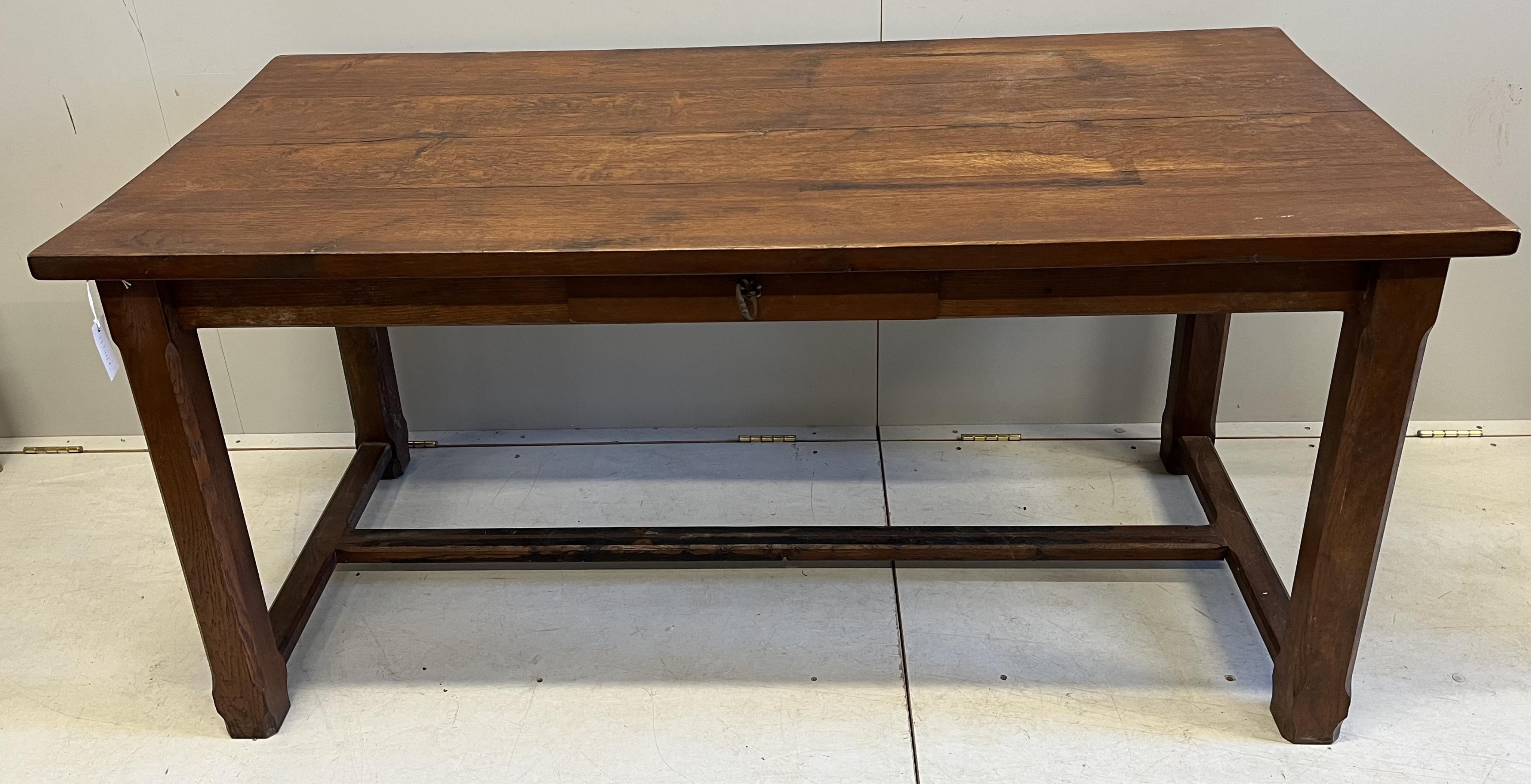 An early 20th century French rectangular oak kitchen table, on chamfered square legs, width 159cm, depth 74cm, height 76cm